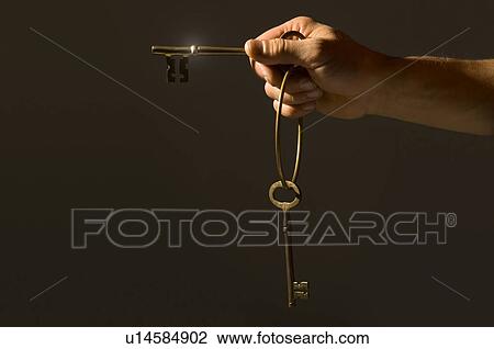 Hand holding keys View Large Photo Image Stock Image - Hand holding keys. Fotosearch