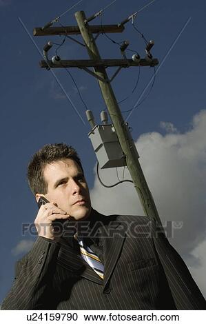 Man on a cell phone View Large Photo Image Stock Image - Man on a cell phone. Fotosearch