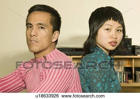 Stock Photograph - Portrait of young couple. Fotosearch
