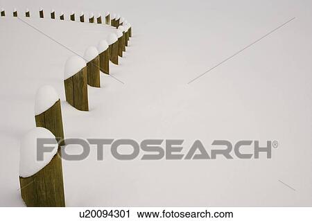Stock Image - Posts covered with fresh snow. Fotosearch