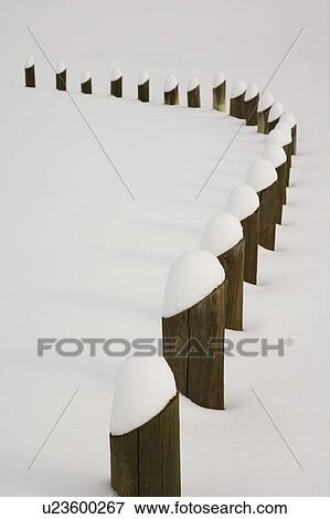 Stock Photo - Posts covered with freshly fallen snow. Fotosearch