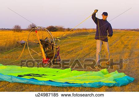 Stock Photography - Powered parachute or paraglider. Fotosearch