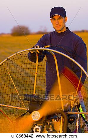 Stock Image - Powered paraglider engine. Fotosearch