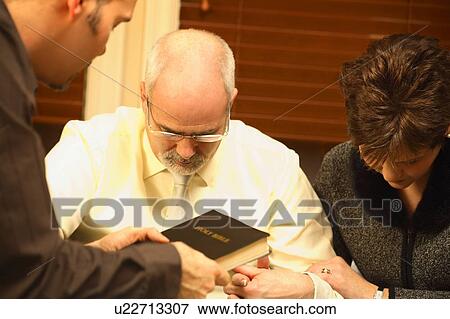 Stock Photo - Prayer meeting. Fotosearch