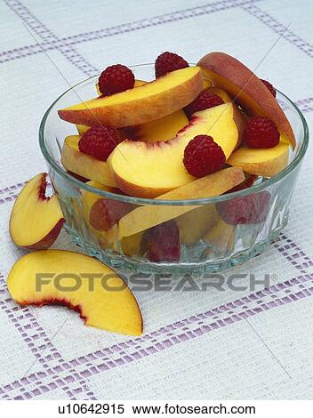 Raspberries and peach slices View Large Photo Image Stock Photography - Raspberries and peach slices . Fotosearch