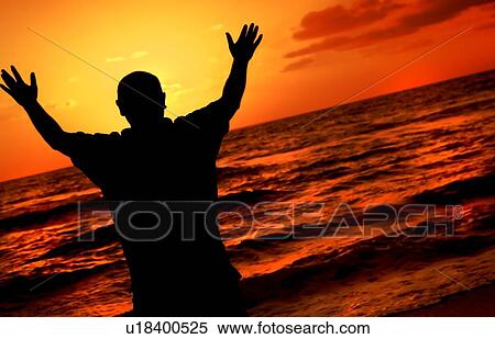 Silhouette of worshipping man View Large Photo Image Stock Photography - Silhouette of worshipping man. Fotosearch