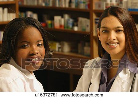 Stock Image - Two female pharmacists. Fotosearch