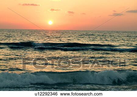 Waves rolling in View Large Photo Image Stock Photograph - Waves rolling in. Fotosearch