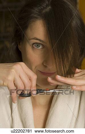 Woman cutting hair View Large Photo Image Stock Image - Woman cutting hair. Fotosearch