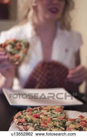 Woman eating pizza View Large Photo Image Stock Image - Woman eating pizza. Fotosearch