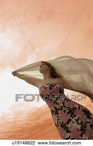 Woman enjoying sunset View Large Photo Image Stock Image - Woman enjoying sunset. Fotosearch