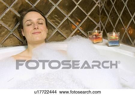 Woman having a bubble bath View Large Photo Image Picture - Woman having a bubble bath. Fotosearch