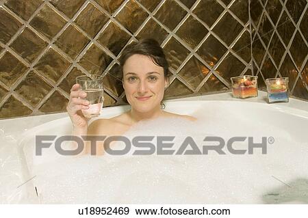 Woman having a bubble bath View Large Photo Image Stock Photo - Woman having a bubble bath. Fotosearch