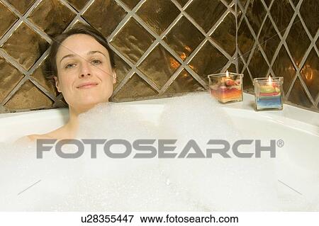 Woman having a bubble bath View Large Photo Image Stock Photo - Woman having a bubble bath. Fotosearch