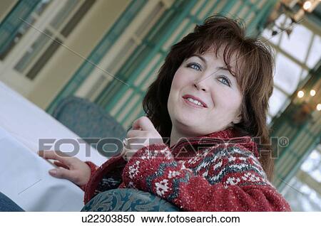 Woman seated View Large Photo Image Stock Image - Woman seated. Fotosearch