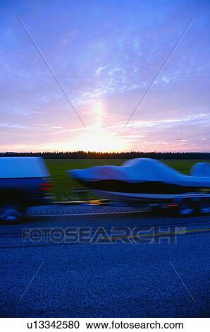 Boat being towed on highway View Large Photo Image Stock Image - Boat being towed on highway. Fotosearch