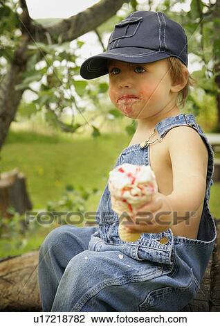 Stock Image - Boy with ice cream cone. Fotosearch