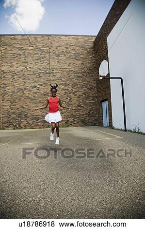 Child jumping rope View Large Photo Image Stock Photo - Child jumping rope. Fotosearch