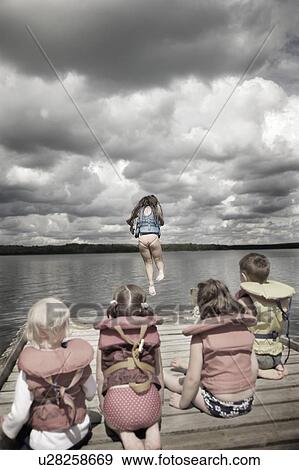 Children watching first water jumper View Large Photo Image Stock Photo - Children watching first water jumper. Fotosearch