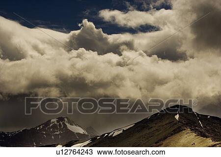Clouds over mountain range View Large Photo Image Stock Image - Clouds over mountain range. Fotosearch