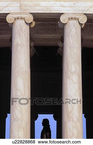 Columns with the silhouette of the Jefferson statue View Large Photo Image Stock Photo - Columns with the silhouette of the Jefferson statue. Fotosearch