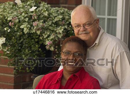 Couple sitting together View Large Photo Image Stock Photograph - Couple sitting together. Fotosearch