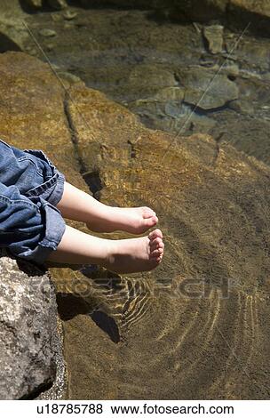 Stock Photo - Little feet testing out water. Fotosearch