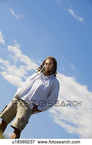 Stock Photo - Man standing outdoors. Fotosearch