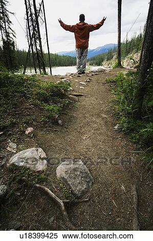 Stock Photography - Man with arms raised. Fotosearch