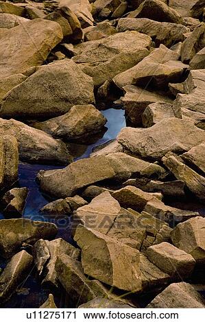 Stock Image - Rocks and water. Fotosearch
