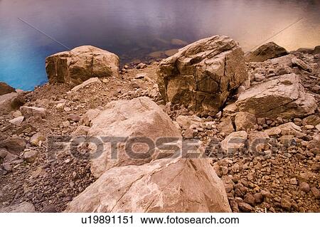 Stock Image - Rocks by the water. Fotosearch