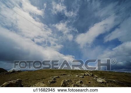 Sky meets rocky hilltop View Large Photo Image Stock Photography - Sky meets rocky hilltop. Fotosearch