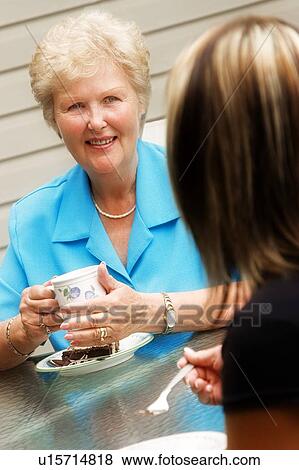 Visiting together View Large Photo Image Stock Photo - Visiting together. Fotosearch
