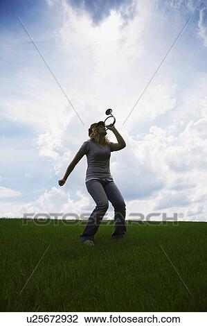 Woman playing horn View Large Photo Image Stock Image - Woman playing horn. Fotosearch