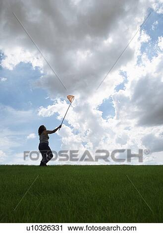 Woman with butterfly-net View Large Photo Image Stock Image - Woman with butterfly-net. Fotosearch