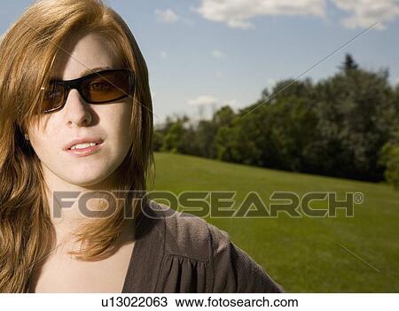 Stock Image - Woman with sunglasses. Fotosearch