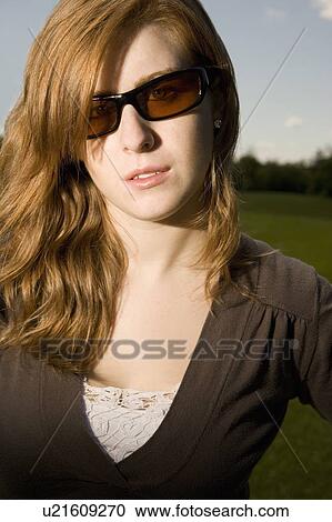 Woman with sunglasses View Large Photo Image Stock Image - Woman with sunglasses. Fotosearch
