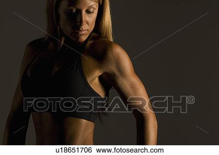 Woman with toned upper body View Large Photo Image Stock Photograph - Woman with toned upper body. Fotosearch