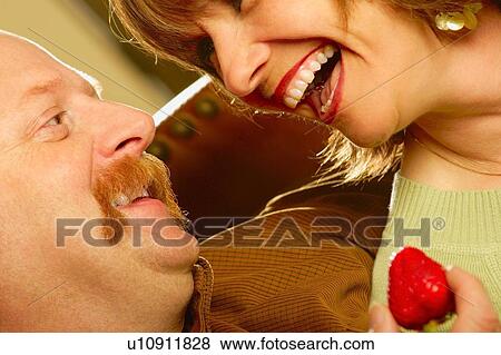 Couple laughing together View Large Photo Image Stock Photo - Couple laughing together. Fotosearch