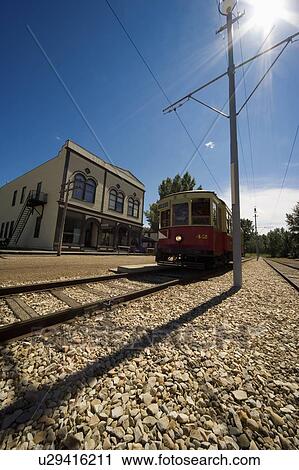 Electric train in town View Large Photo Image Stock Image - Electric train in town. Fotosearch