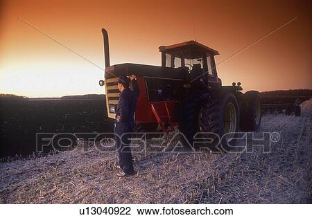 Farmer standing in the field View Large Photo Image Stock Image - Farmer standing in the field. Fotosearch