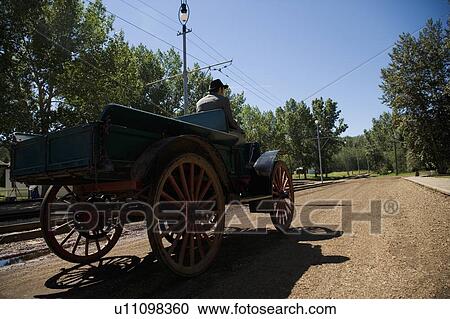 Man driving vintage car View Large Photo Image Stock Image - Man driving vintage car. Fotosearch