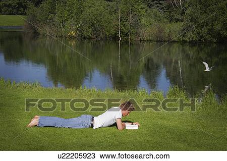 Man reading outside View Large Photo Image Stock Image - Man reading outside. Fotosearch