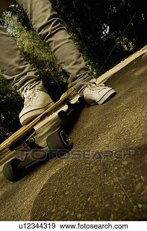 Stock Photo - Person on skateboard. Fotosearch