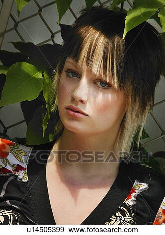 Portrait of a young woman View Large Photo Image Stock Photo - Portrait of a young woman . Fotosearch
