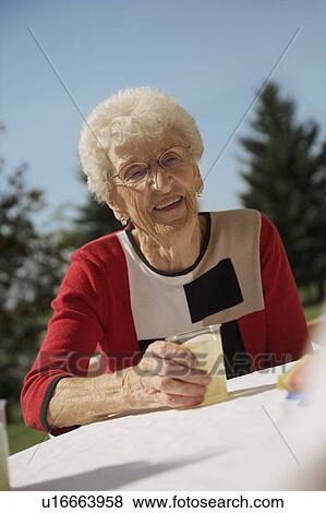 Senior woman with juice View Large Photo Image Stock Photo - Senior woman with juice. Fotosearch