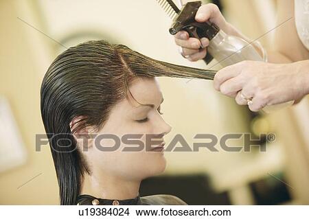 Woman having her hair cut View Large Photo Image Picture - Woman having her hair cut. Fotosearch