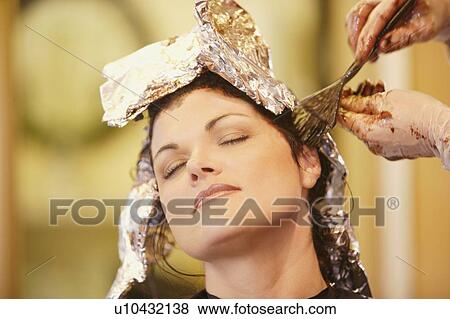 Woman having her hair dyed View Large Photo Image Stock Photo - Woman having her hair dyed. Fotosearch
