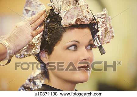 Woman having her hair dyed View Large Photo Image Stock Photo - Woman having her hair dyed. Fotosearch
