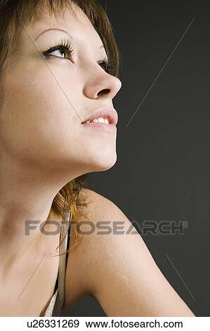 Stock Photo - Woman looking up. Fotosearch